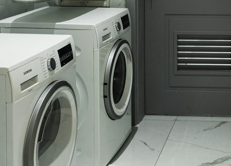 A washer and dryer set side by side